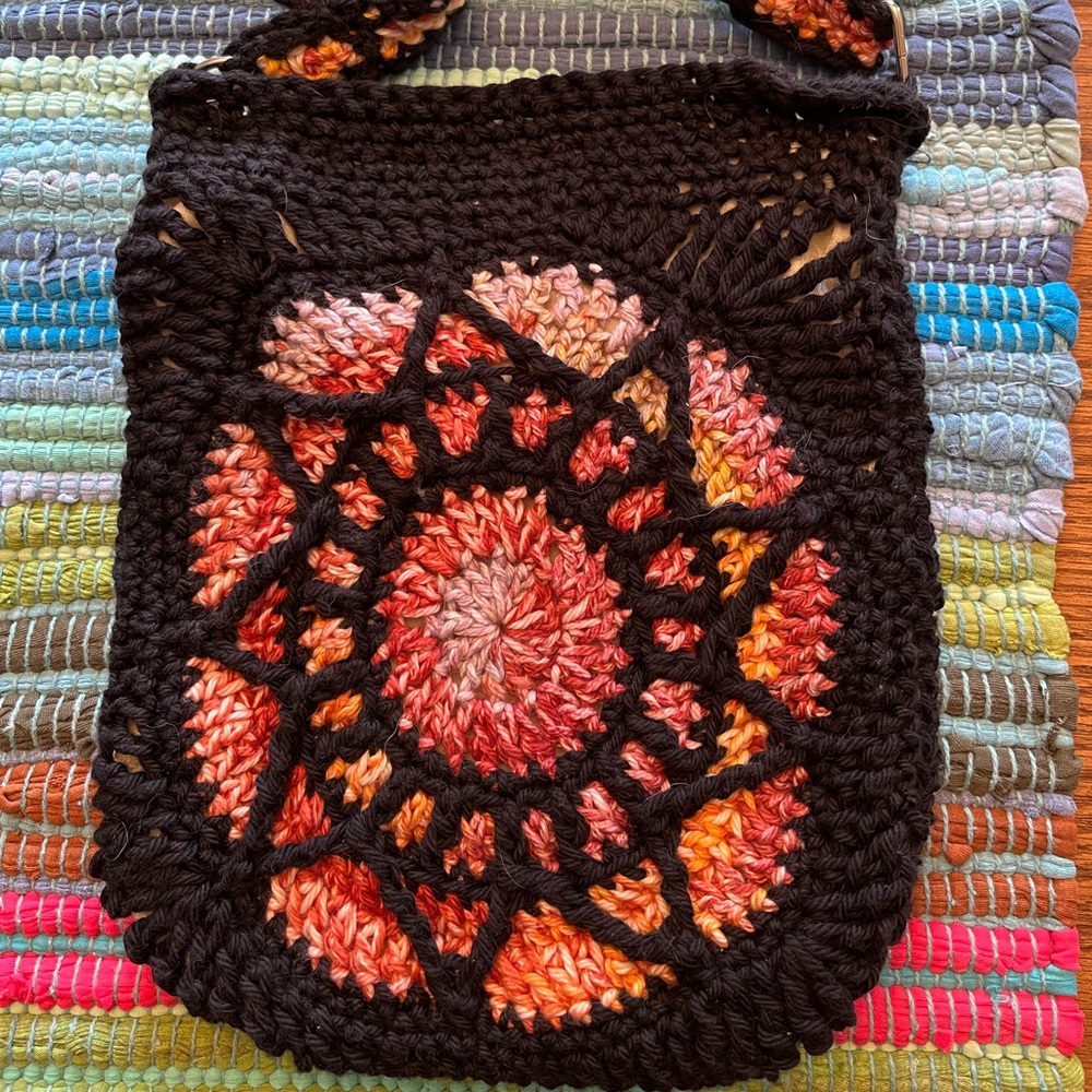 Handmade crochet crossbody purse stain glass design, lined with magnet closure